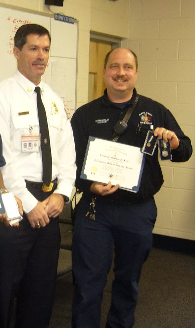 Asst. Chief of the Fairfax County Fire Dept. , David Rohrer (left) and Lieutentant Matthew Malof after receiving the EMS Commendation Medal
