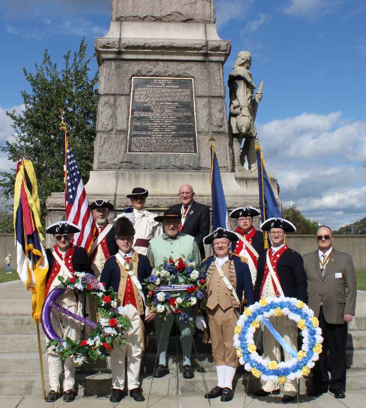 VASSAR members gather for a picture in front of the Monument to the battle in Point Pleasant