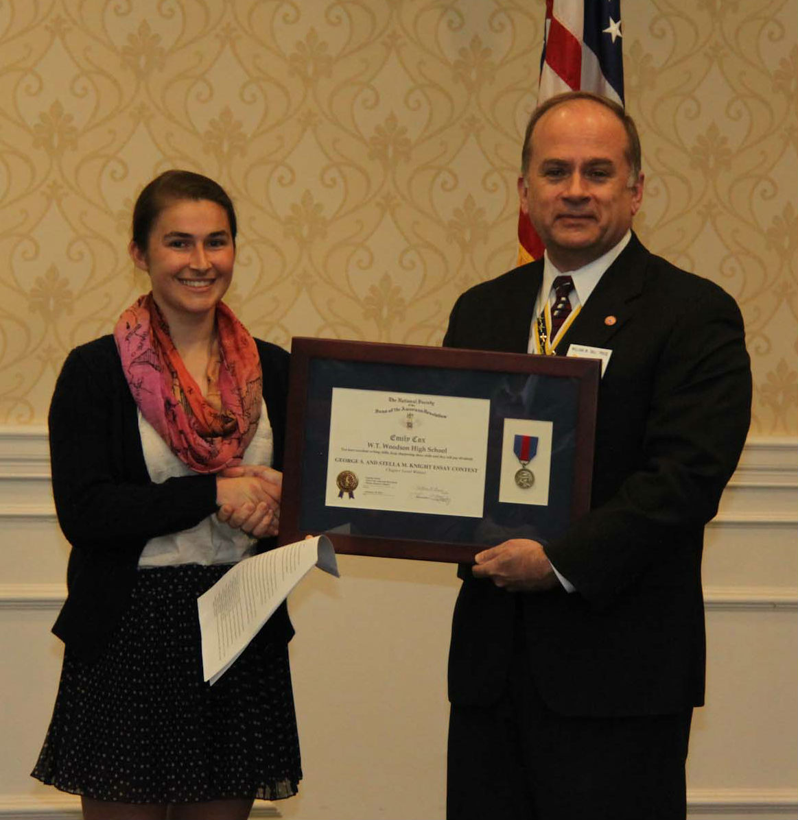 Chapter President Bill Price presents Ms. Cox with the award for her winning essay