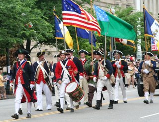 The National Society Color Guard marches in the Memorial Day Parade through downtown Washington D.C.