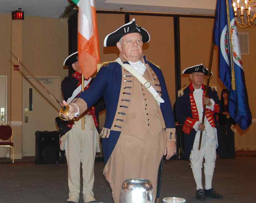 Color Guard Commander Larry McKinley leads Guardsmen Darrin Schmidt (not pictured), Andy Johnson, and Trice Taylor in presenting the Colors, including the flag of Ireland, at the Rhythm of Ireland Feis in Williamsburg, VA.